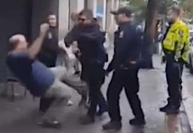 Video shows a Vancouver cop shoving someone to the sidewalk for no apparent reason